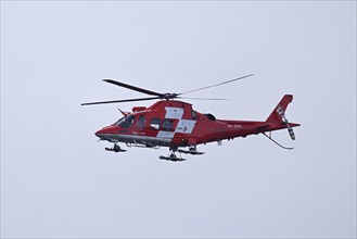 Rega rescue helicopter in flight, Canton of Lucerne, Switzerland, Europe