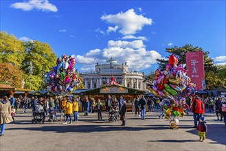 Colourful balloons and visitors at the Christmas market at City Hall, behind the Burgtheater,