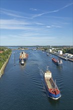 Cargo ships waiting in front of the lock, Kiel Canal, Holtenau, Kiel, Schleswig-Holstein, Germany,