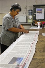 Liberal, Kansas, Lisa Diaz puts mailing labels on copies of the Kiowa County (Colorado) Independent