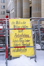 Demonstration, posters and barriers at the Brandenburg Gate, Berlin, Germany, Europe