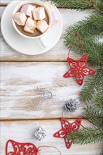 Christmas or New Year frame composition. Decorations, red stars, bells, cones, fir and spruce