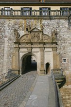 Portal, gate, round arch, bridge, cobblestones, stone figures, coat of arms, relief, decoration,