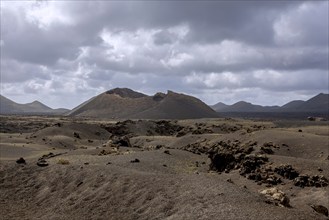 Volcanic landscape with view of the Caldera de Los Cuervos, Timanfaya National Park, Lanzarote,