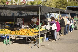 People buying fruit and vegetables at market stall, San Jose, Almeria, Spain, Europe