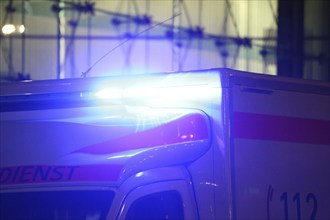 Close-up of a blue light on an ambulance at night (Berlin)