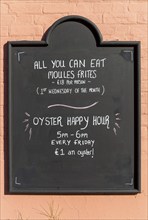 All You Can Eat Moules Frites, Oyster Happy Hour, pub blackboard food offer, England, UK