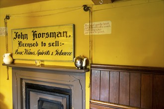 Traditional interior of Kings Head village pub, the Low House, Laxfield, Suffolk, England, UK bell