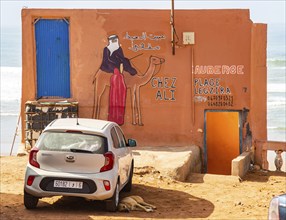 Sign for auberge tourist accomodation on beach, Legzira plage, southern Morocco, north Africa