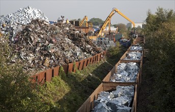 Scrap metal recycling loading train wagons with processed metals, EMR company, Swindon, England, UK