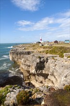 Red and white lighthouse on the coast at Portland Bill, Isle of Portland, Dorset, England, United