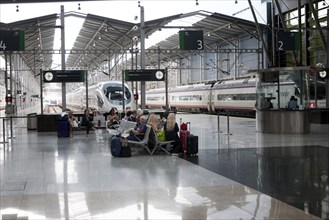 Passengers wait for trains at platforms inside María Zambrano railway station Malaga, Spain, Europe