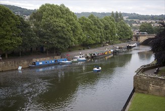 Boats at moorings on the River Avon, Bath, Somerset, England, United Kingdom, Europe