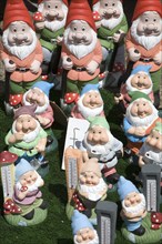 Colourful garden gnomes lined up for sale, UK