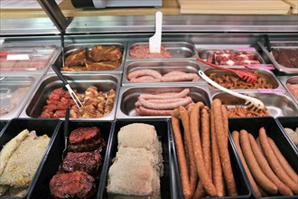 Variety of fine meat products in the butchery (Variety of fine meat products in the butchery)