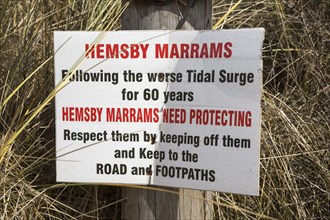 March 2018, Notice sign warning of danger and damage it Marrams sand dunes, Hemsby, Norfolk,