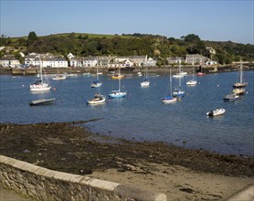 Yachts at moorings on River Fal, Flushing, Cornwall, England, UK