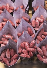 Small sausages packed for sale, Mercado San Miguel market, Madrid city centre, Spain, Europe