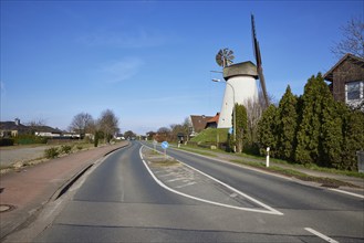 Windmill Hummelbecker Mühle under a cloudless blue sky, a Wall-Holländer, is part of the