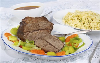 Swabian cuisine, roast beef, roast ox, herb spaetzle, meat dish, gravy, carrot vegetables, leek,