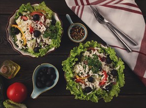 Traditional Bulgarian dish, Shopska salad, on a wooden table, salad of fresh vegetables, top view,