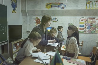 Pupils in a classroom in one of the metro schools in Kharkiv. Classrooms were set up in various