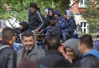 Refugees from Syria waiting to be registered at the Central Reception Centre for Asylum Seekers at