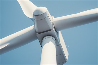 Center of wind mill turbine in front of blue sky. Generative Ai, AI generated