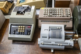 Vintage mechanical calculator adding machines on display at auction, UK including Brunsviga,