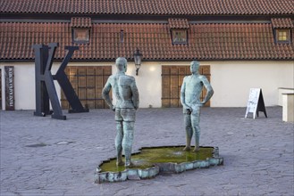 Two male figures peeing, sculpture by the artist David Cerny in front of the Franz Kafka Museum,