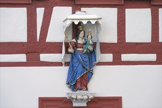 Figure of a saint on a house, Iphofen, Lower Franconia, Bavaria, Germany, Europe