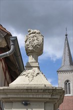 Vase attachment on a courtyard gate, 1774, behind the tower of the parish church of St John the