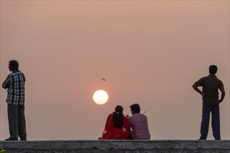 Two men and a couple, sunset, Fort Cochin, Kochi, Kerala, South India, India, Asia