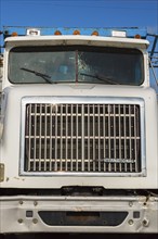 Front end of International truck cab with damaged windshield, Quebec, Canada, North America