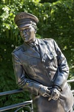 Bronze statue, monument to rock singer Elvis Presley, King of Rock 'n' Roll in uniform of the 3rd