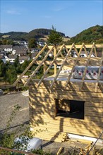 Shell of a wooden house, building, completely made of wood, in the village of Hesborn, in