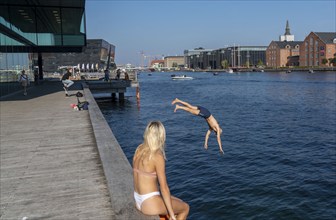 Summer, swimming in the harbour of Copenhagen, there are official bathing places, harbour baths and