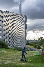 CopenHill, waste incineration plant and artificial ski slope, skiing with a view of the ski lift,