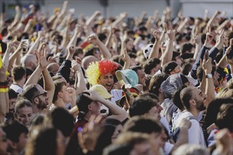 Fans react during the European Championship preliminary round match between Germany and Hungary on