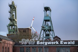 Former RAG Ewald mine, headframes, shaft 7, right and shaft 2, left, behind the wind power station