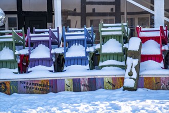 Winter in the Ruhr area, Lake Baldeney, snow-covered beer garden furniture of a restaurant, Haus am