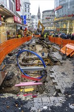 Construction site in the city centre of Wuppertal, laying of new pipelines, various supply lines