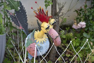 Tin bird in a front garden, Bavaria, Germany, Europe