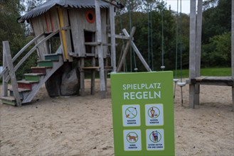 A sign at the edge of a playground points out the rules to be observed, Ganzlin,