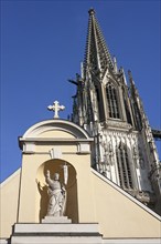 Sculpture of Christ at St John's Chapel, completely rebuilt in 1766, on the right a tower from St