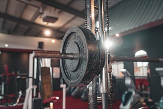 Dumbbell bar with weight in the centre of a fitness room, Historic Fitness Studio, Bulls Fit,