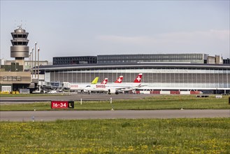 Swiss airline aircraft at Zurich Airport. Terminal and tower. Zurich, Switzerland, Europe