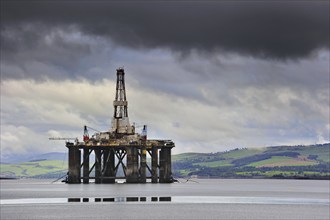 Oil rig, oil drilling platform waiting to be repaired in Cromarty Firth near the port of