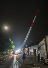 Transport of a 68 metre long, 22 tonne blade of a wind turbine, here in Breckerfeld, with a