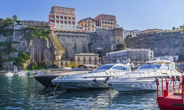 Steep coast of the village at the harbour with sports boats, Sorrento, Sorrento Peninsula, Gulf of